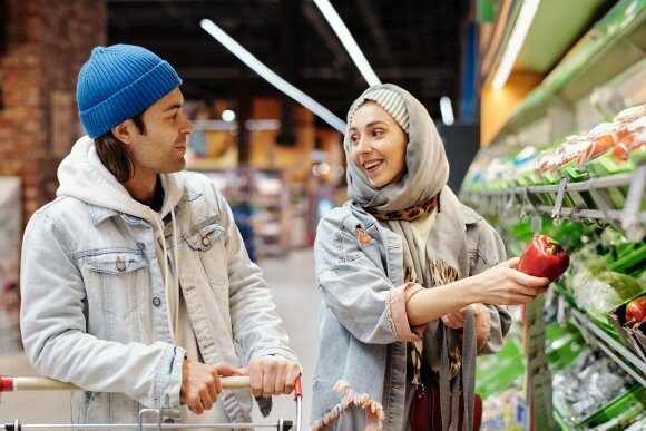 happy couple buying groceries